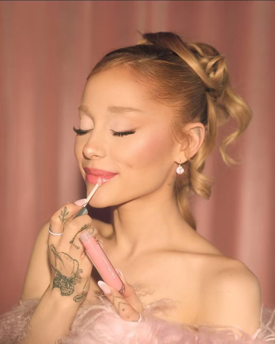 Ariana Grande romantic blonde updo hairstyle with curled ponytail
