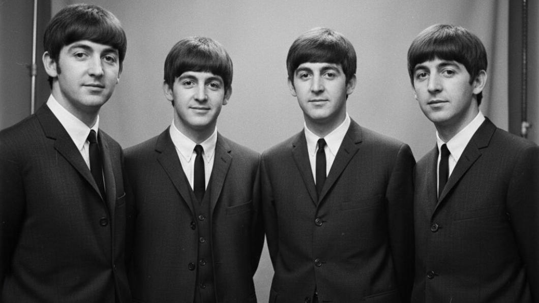 The Beatles in 1964 showcasing their iconic matching Mop-top haircuts during the British Invasion