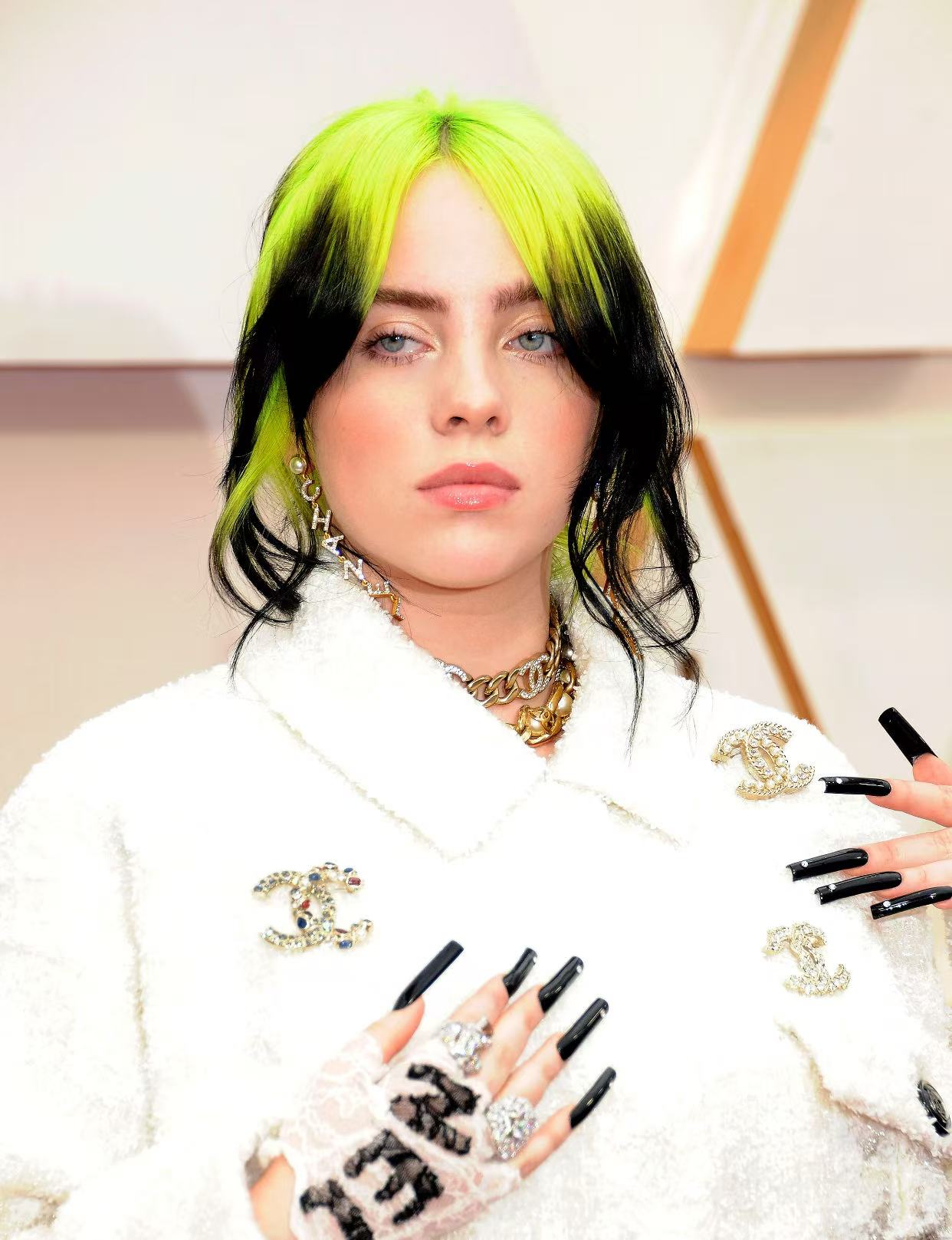 Billie Eilish neon green roots with black hair hairstyle