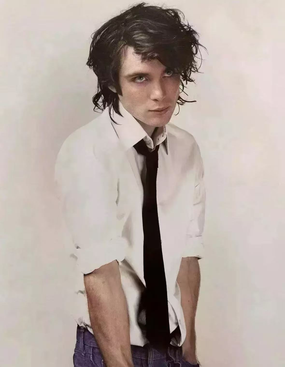Cillian Murphy dramatic messy dark textured hairstyle