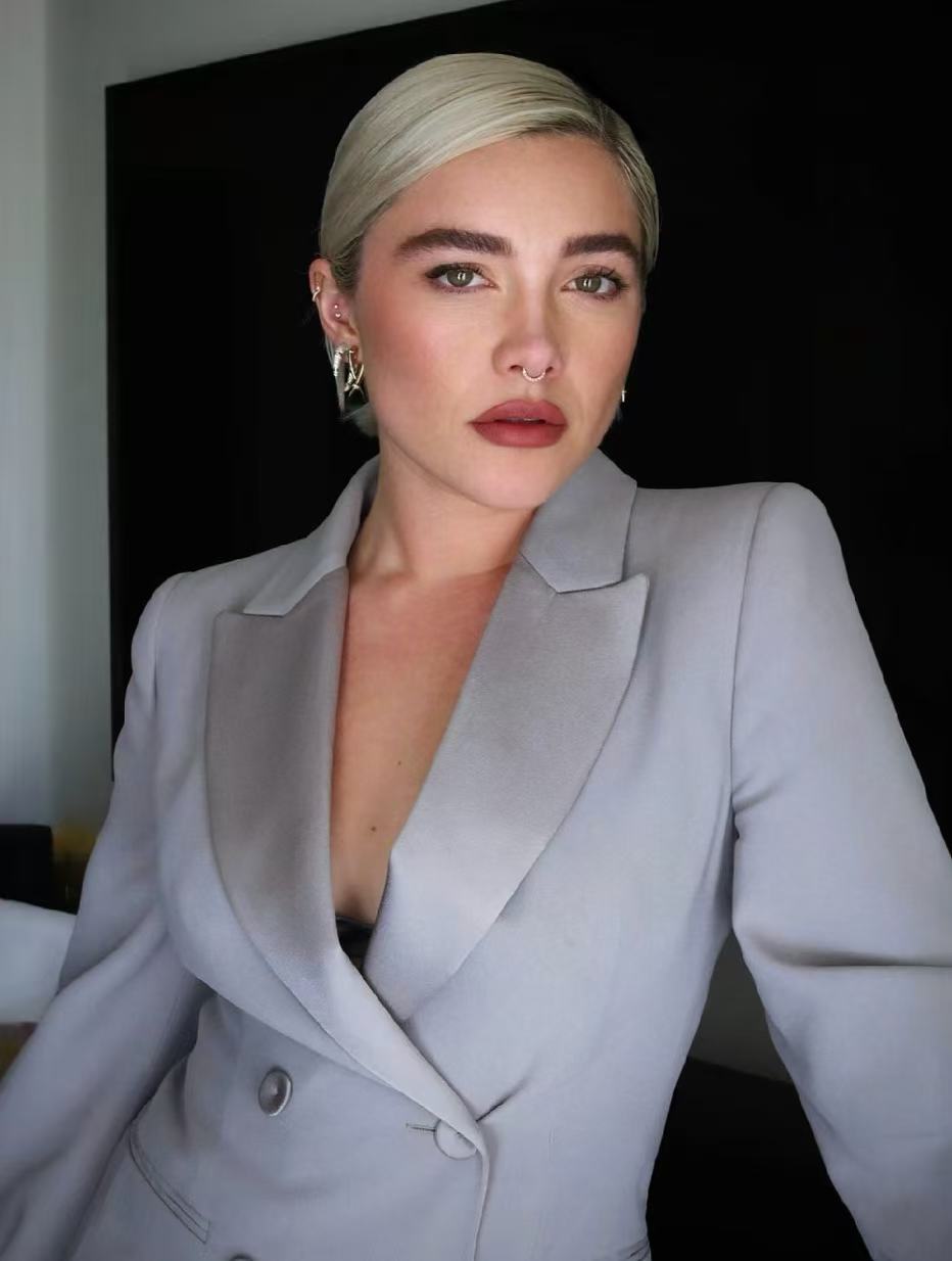 Florence Pugh sleek platinum short crop hairstyle