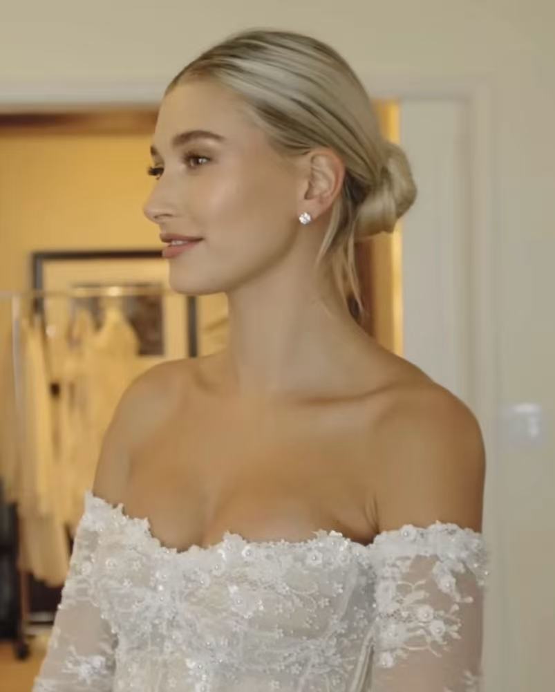 Hailey Bieber inspired slicked back low bun with middle part