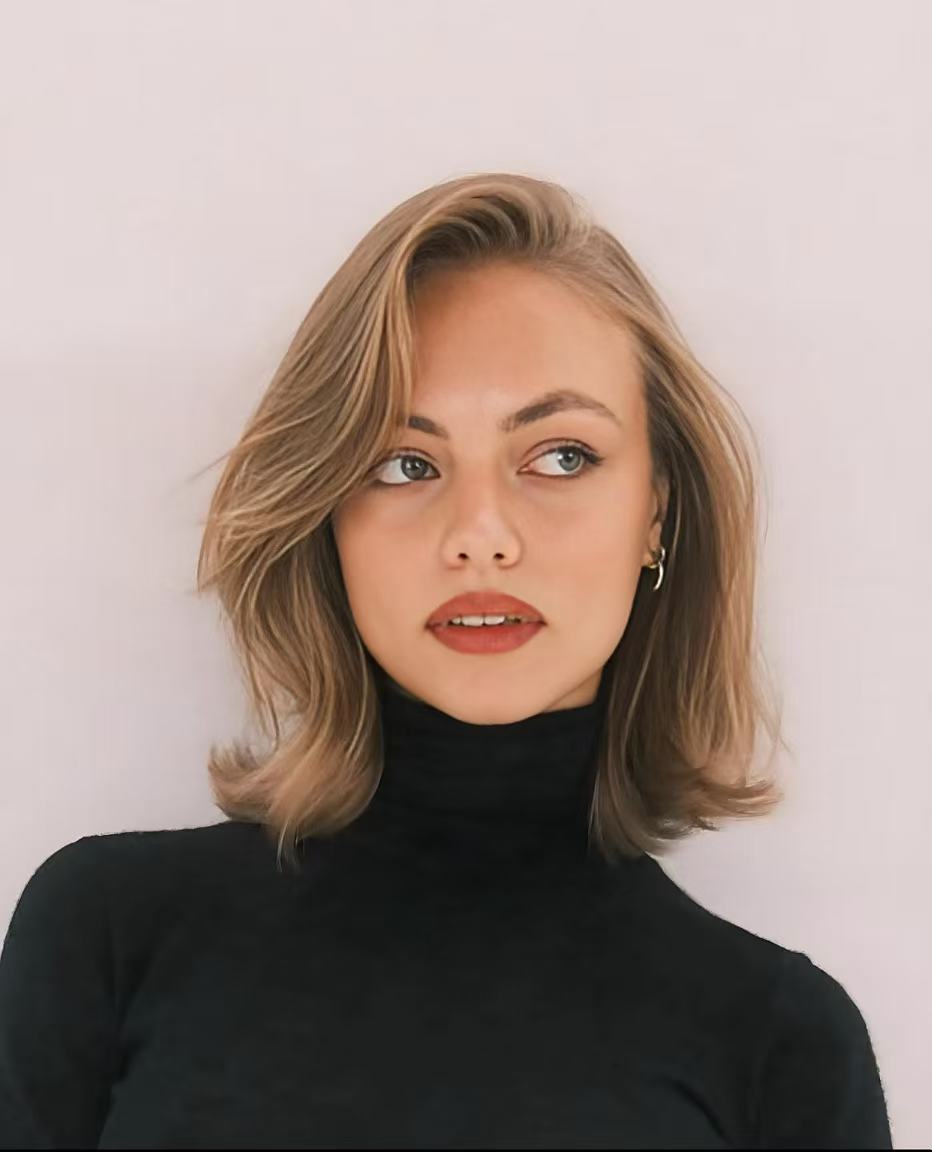 Blonde layered lob with soft face-framing movement
