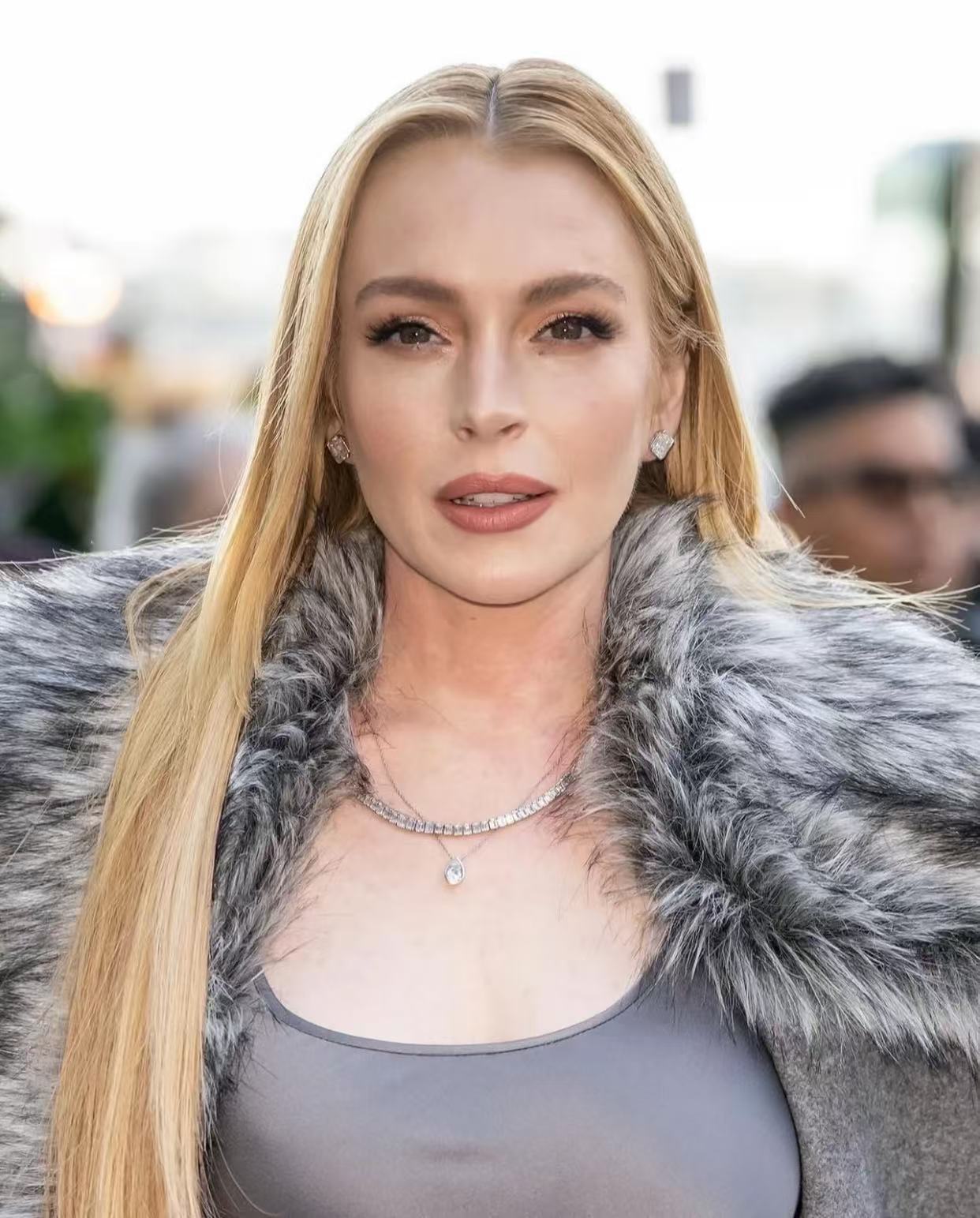 Long straight blonde hair with a clean middle part