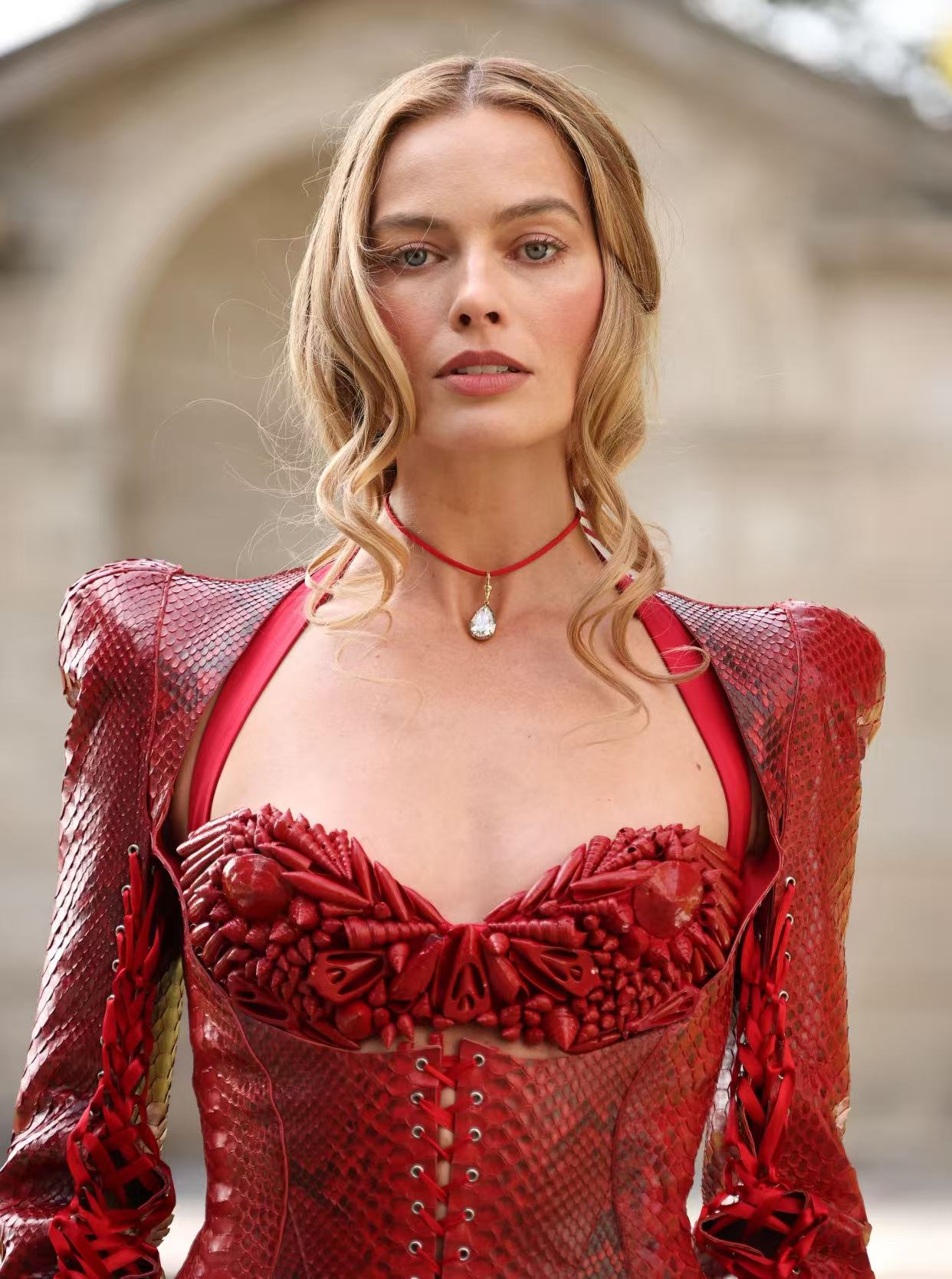 Margot Robbie blonde updo with face framing curls