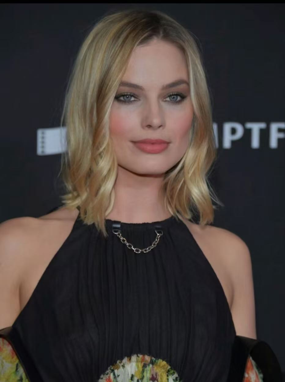 Margot Robbie soft blonde lob with waves