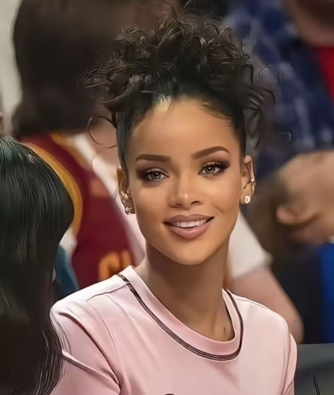Rihanna inspired textured high updo with curly pieces