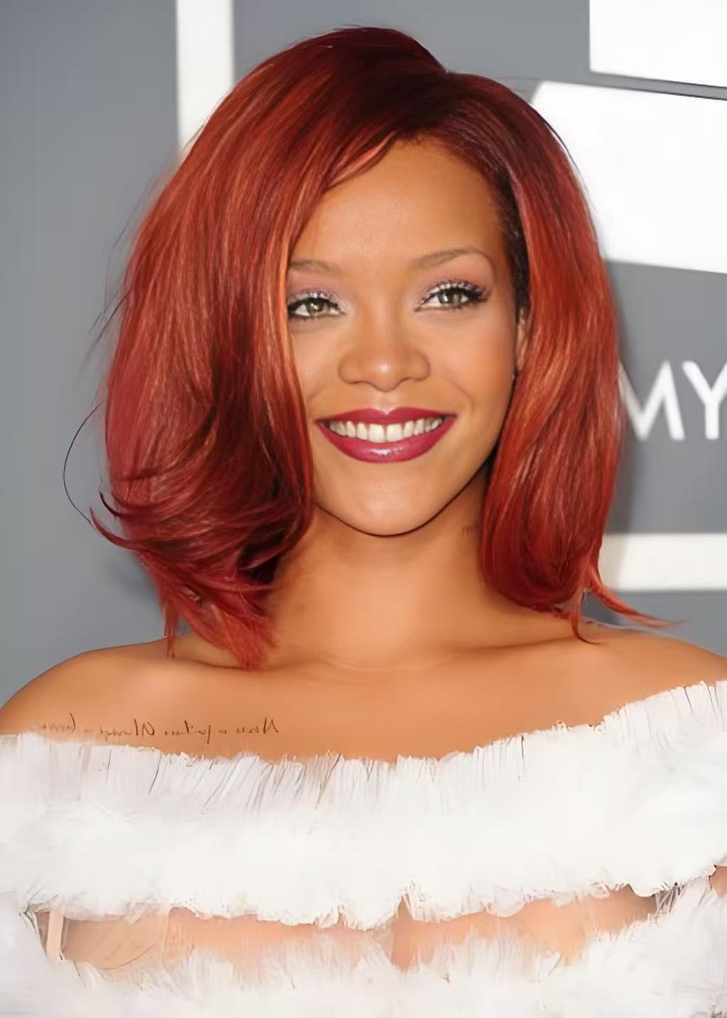 Rihanna inspired vivid red side parted bob with glossy finish
