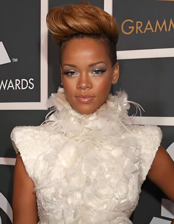 Rihanna inspired sculptural pixie cut with copper blonde volume