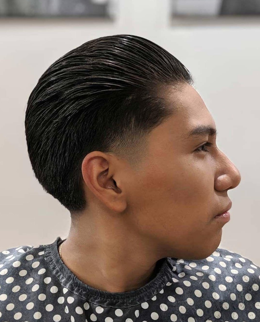 Side view of shiny slick back hairstyle