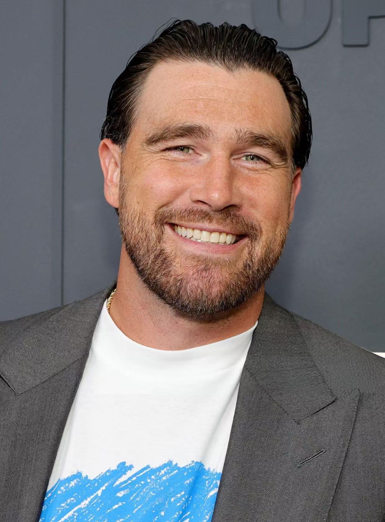 Travis Kelce slicked back hairstyle with beard