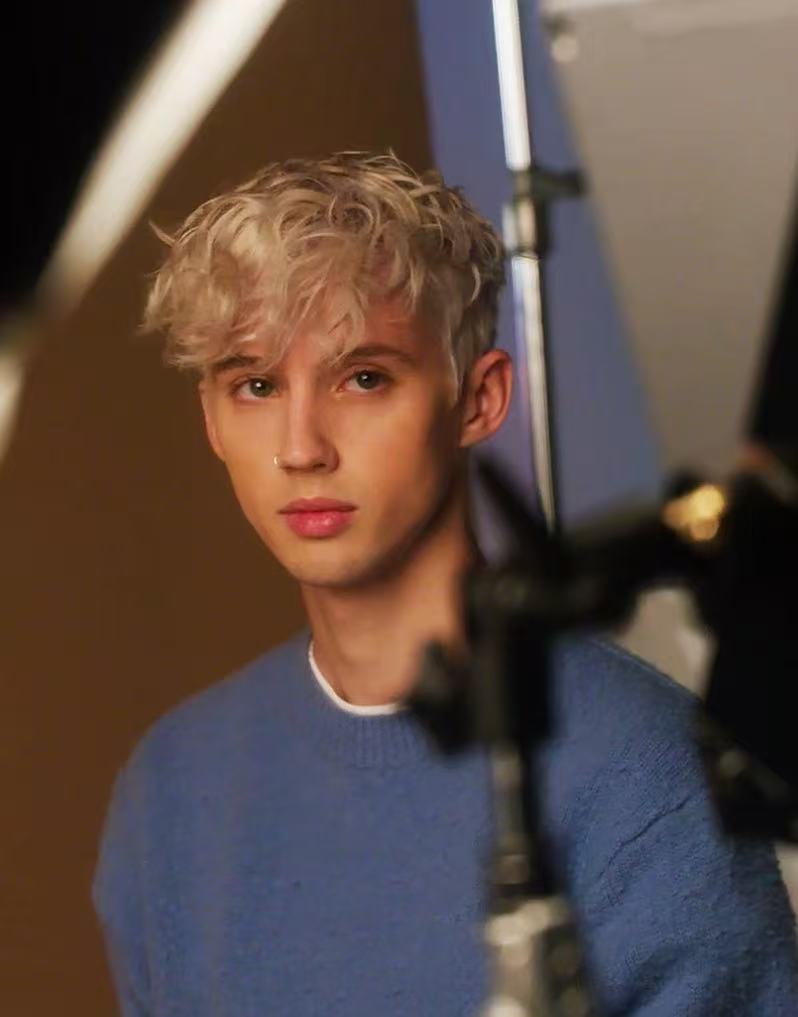 Troye Sivan bleached blond messy fringe hairstyle